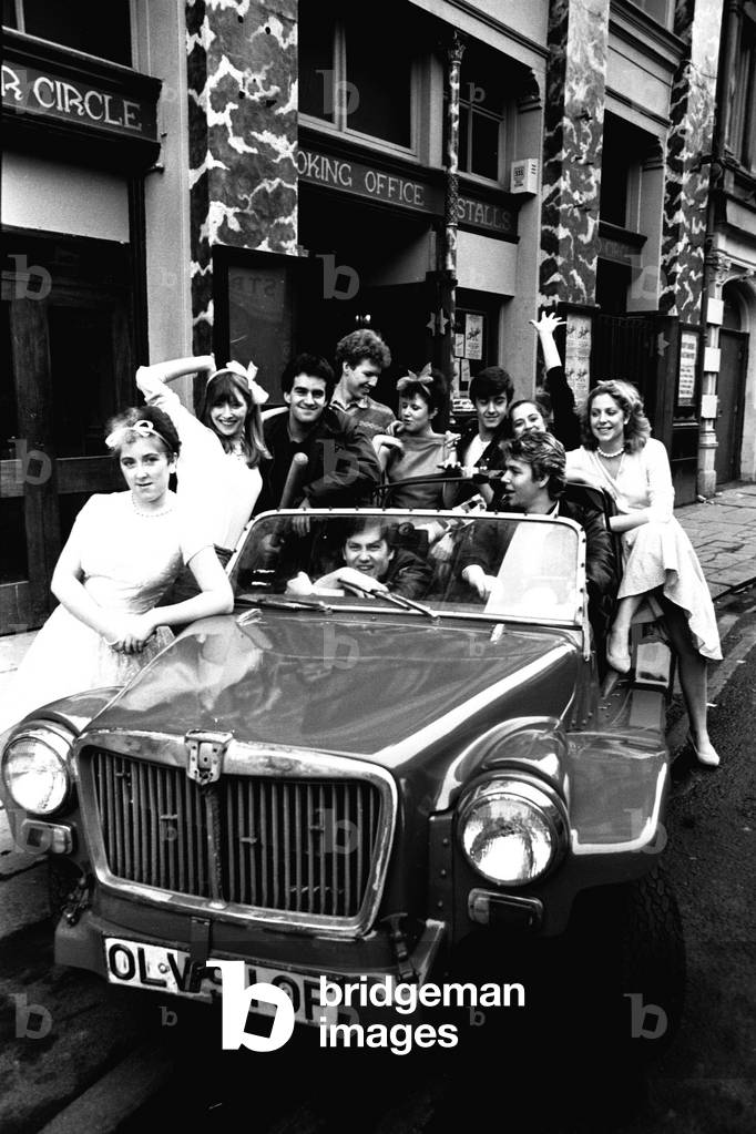 Newcastle University students on a photo call outside the New Tyne Theatre, Westgate Road, Newcastle on 29th February 1984 (b/w photo)