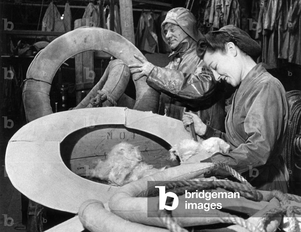 Miss Vera Pearson helping in the rigging loft of the Royal National Lifeboat Institutions Stores. 
28th December 1944