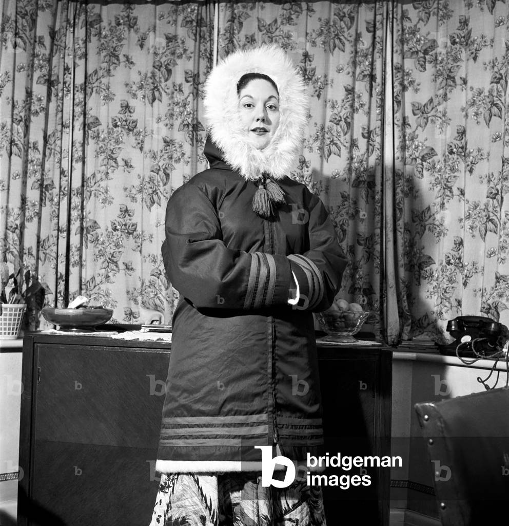 Clothing: Eskimo Coats: Mrs. Betty Wyatt teaches Eskimos on Baffin Island seen here on holiday with her two sons Philip and Nicholas, January 1958 (b/w photo)