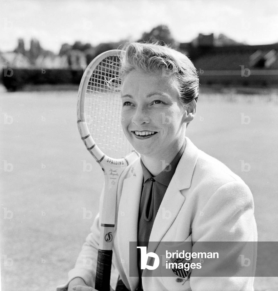 Darlene Hard the American tennis star photographed at Wimbledon today. 
June 1960