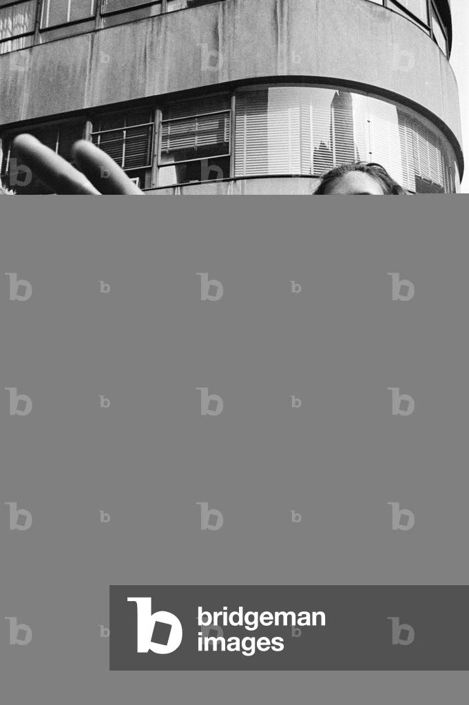 The Beatles in New York City, on their North American Tour ahead of their concert to be held at Forest Hills. Cheering fans gathered outside the Delmonico Hotel in New York where the band are staying. 28th August 1964 (b/w photo)