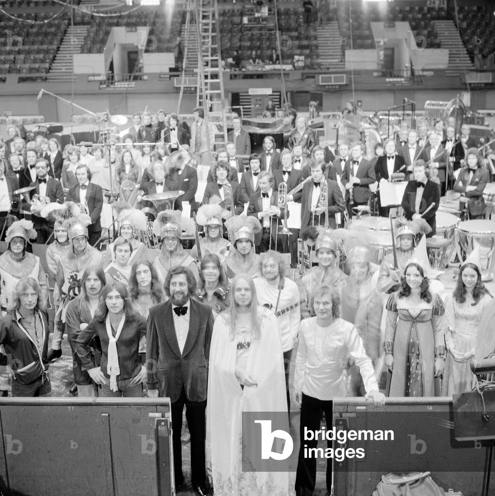 Rick Wakeman and the cast of King Arthur and the Knights of the Round table on ice at the Empire Pool Wembley, May 1975 (b/w photo)