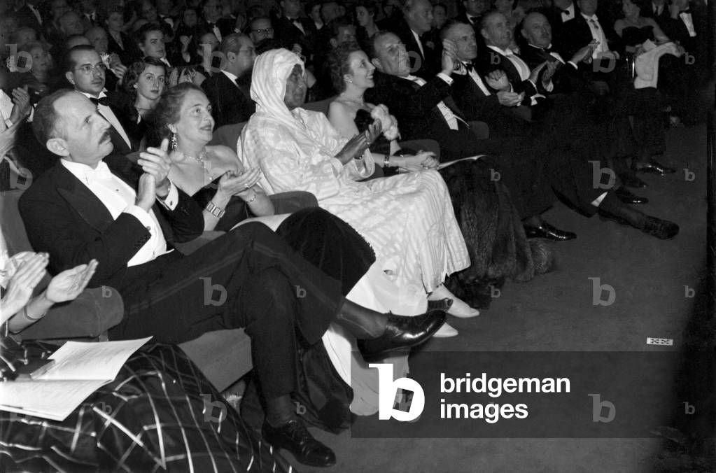 Politician Berber Pasha (Thamil el Galoui) enjoys a night at the theatre in Marrakech, Morocco, December 1952 (b/w photo)