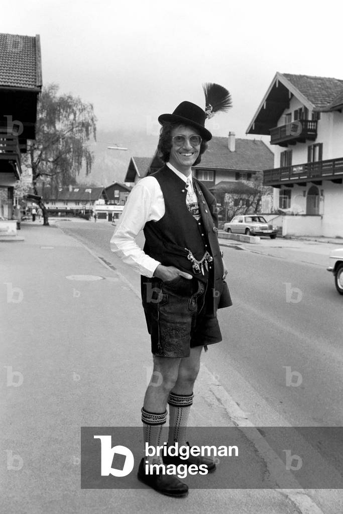 Chris Ward wearing Lederhosen in the village of Ruhpolding, near Munich, May 1975 (b/w photo)