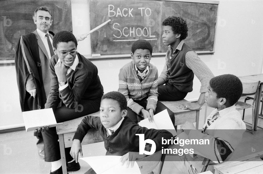 Musical Youth, British Jamaican pop / reggae group, return to school, Duddeston Manor School, and are greeted by deputy headmaster John Cook 2nd November 1983 (b/w photo)