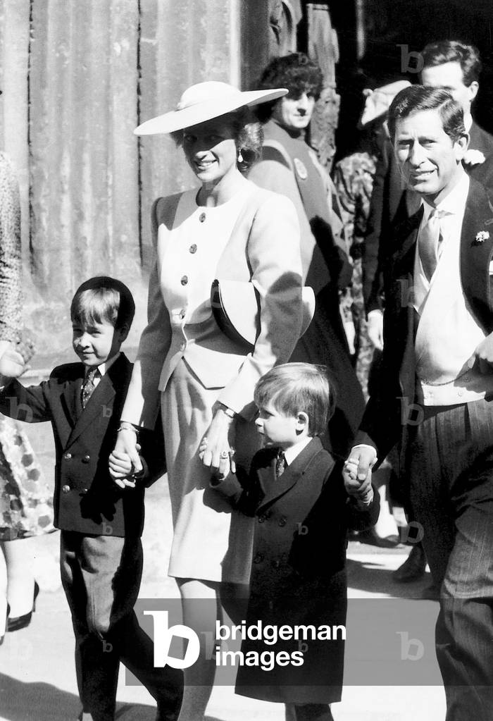 Prince Charles Prince of Wales with Princess Diana, Prince William, and Prince Harry, at the wedding of Sir Francis Brooke and Katherine Hussey, 1989 (b/w photo)