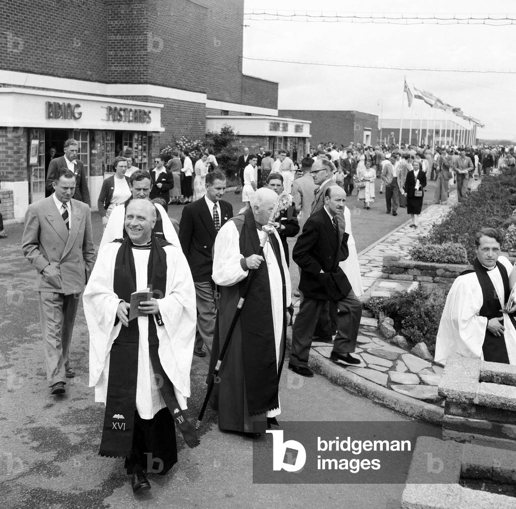 Dr. Cyril Garbett, the Archbishop of York visiting Butlins Holiday Camp, Filey, North Yorkshire. He visited Filey camp to conduct mass outdoor services once a year. 30th July 1954 (b/w photo)