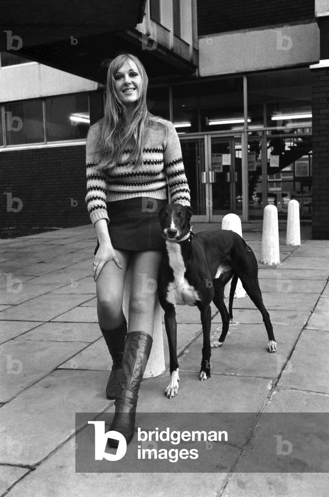 People with animals. Woman. Fiena Ward with her dog Barnabas outside Manchester College of Art. November 1969