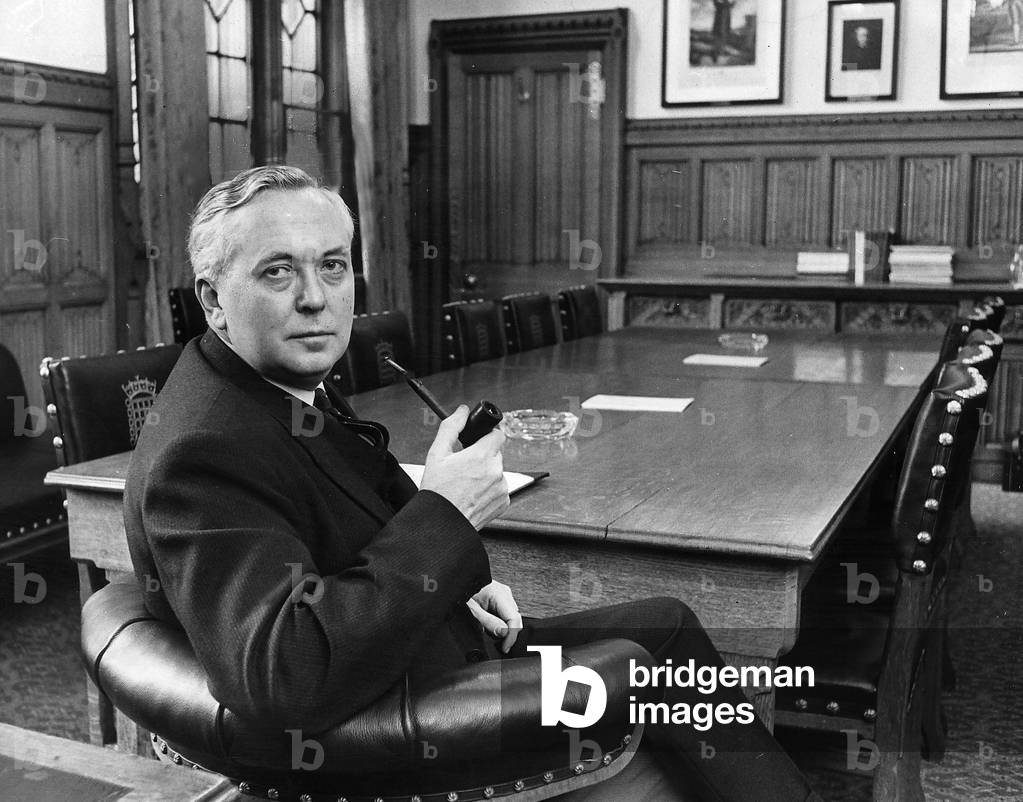 Harold Wilson sits at the head of the table in the leader of the oppositions room at the house of commons, 1963