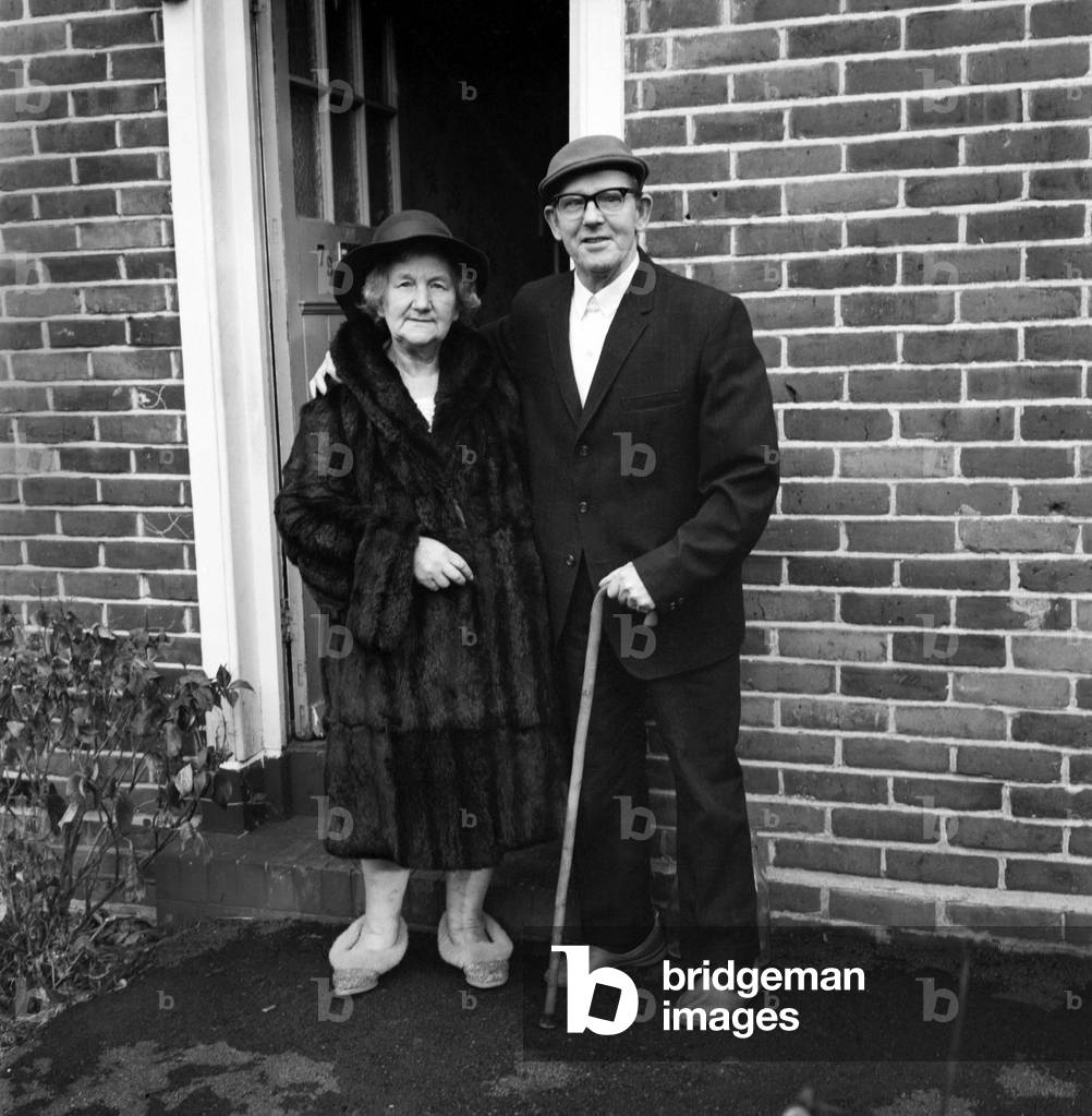 People old couple. Elderly man and woman at their home. November 1969
