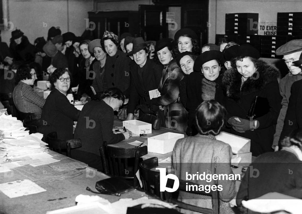 World War Two - Second World War - Busy scenes at Newcastle Food Control Office, when many householders made applications to change their retailers of rationed foods. 21st January 1941 (b/w photo)