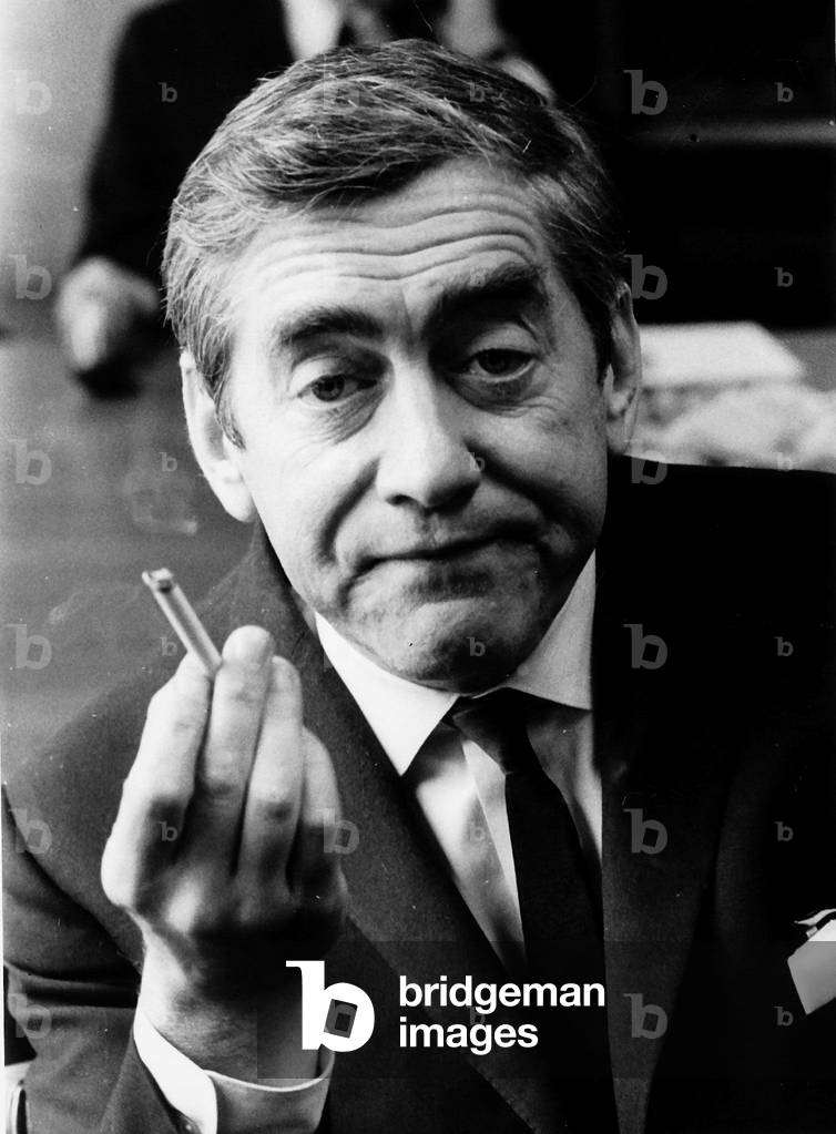 Tony Hancock holding up a lit cigarette
August 1966