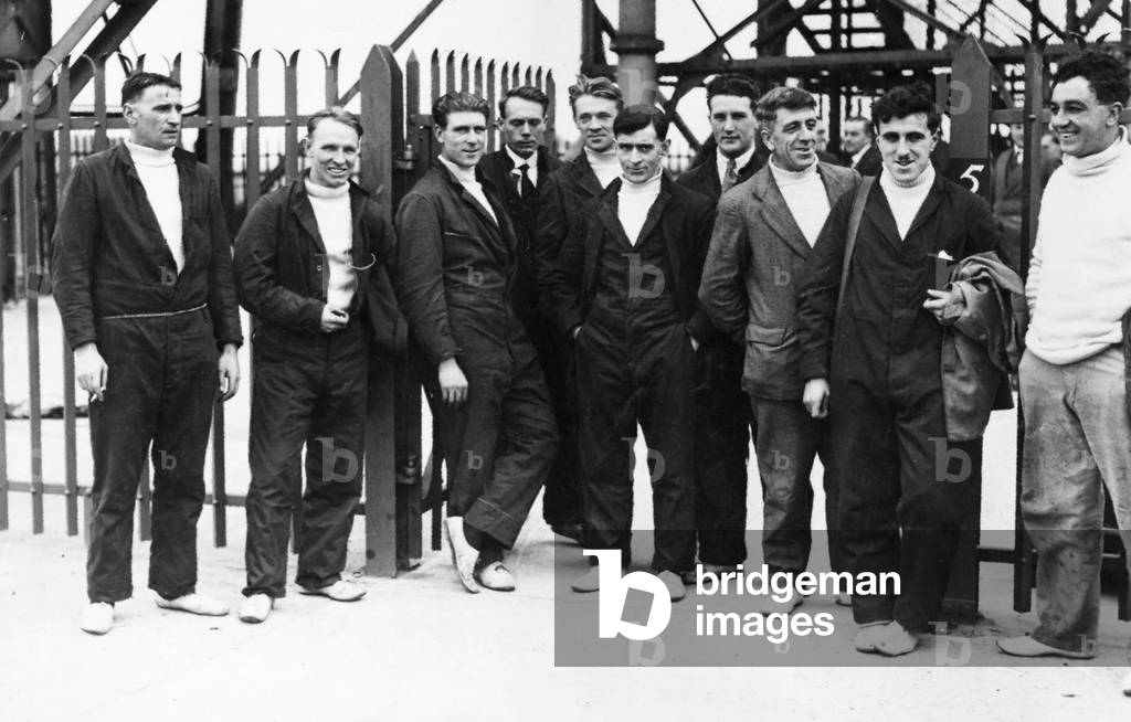 Some of the crew of the R101 airship seen here at Cardington before embarking on a test flight of the airship. Left to right F Kemp (rigger), G Taylor (rigger), H Rowe (rigger), F Noble (engineer), Hector Ford (rigger) Charle Arthur Burton (engineer), Maurice Frank Littlekitt (engineer) J Binks (engineer), A Cook (engineer) and Wilfred Moule (engineer), 24th October 1929 (b/w photo)