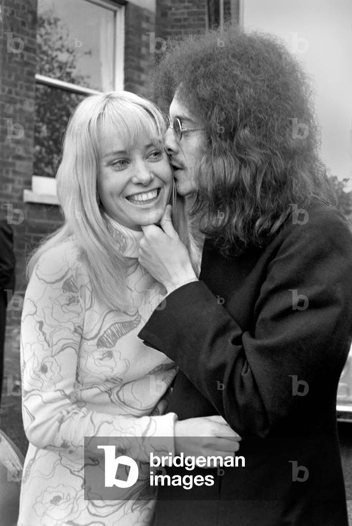Noel Redding who played in the Jimi Hendrix experience band with bride Susan Fonsby pictured after their wedding by a Rolls Royce Car. 
November 1969