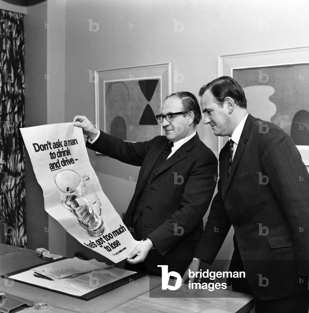 Politics. Fred Mulley Minister of Transport outlined his plans for a Christmas safety drive to Sunday Mirror motoring correspondent Roy Spicer this afternoon. Amongst the literature was a large poster and a driving manual which Mr. Mulley suggested (the manual) would be an ideal Christmas present for every driver. December 1969