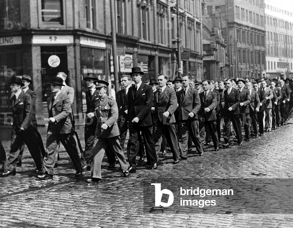 World War Two . British Army recruits march in the parade to St Thomas's Church, Newcastle. The old soldier in the parade was formerly of the Tyne Electrical Engineers. 27th May 1939 (b/w photo)