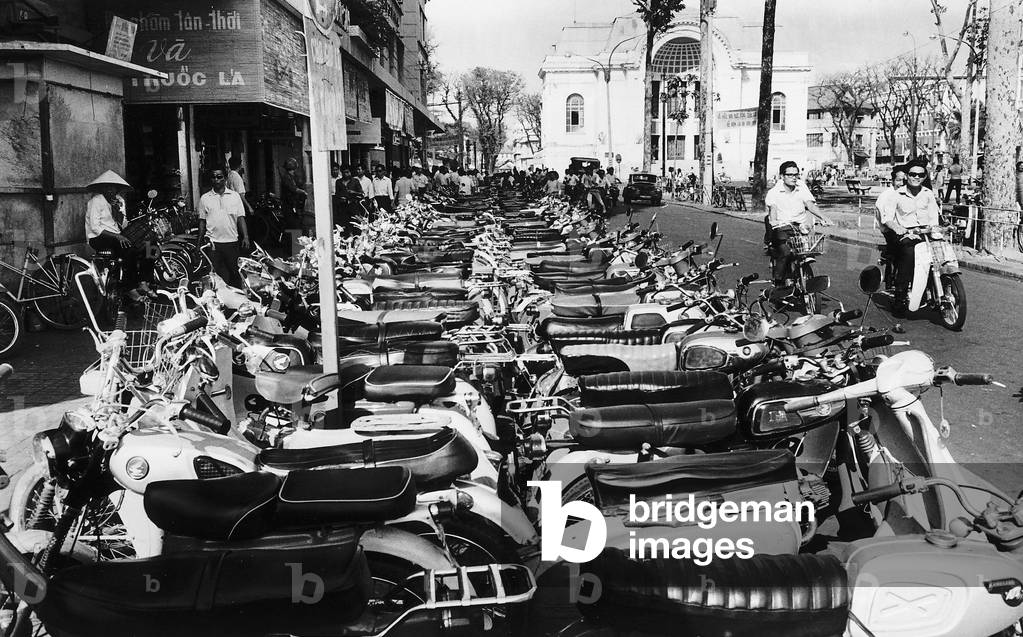 A huge population of motorcycles is causing a health hazard in the centre of Saigon February 1970 (b/w photo)