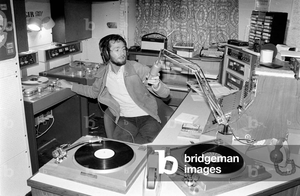Disc. Jockey: Kenny Everett seen here in his home studio, February 1978 (b/w photo)
