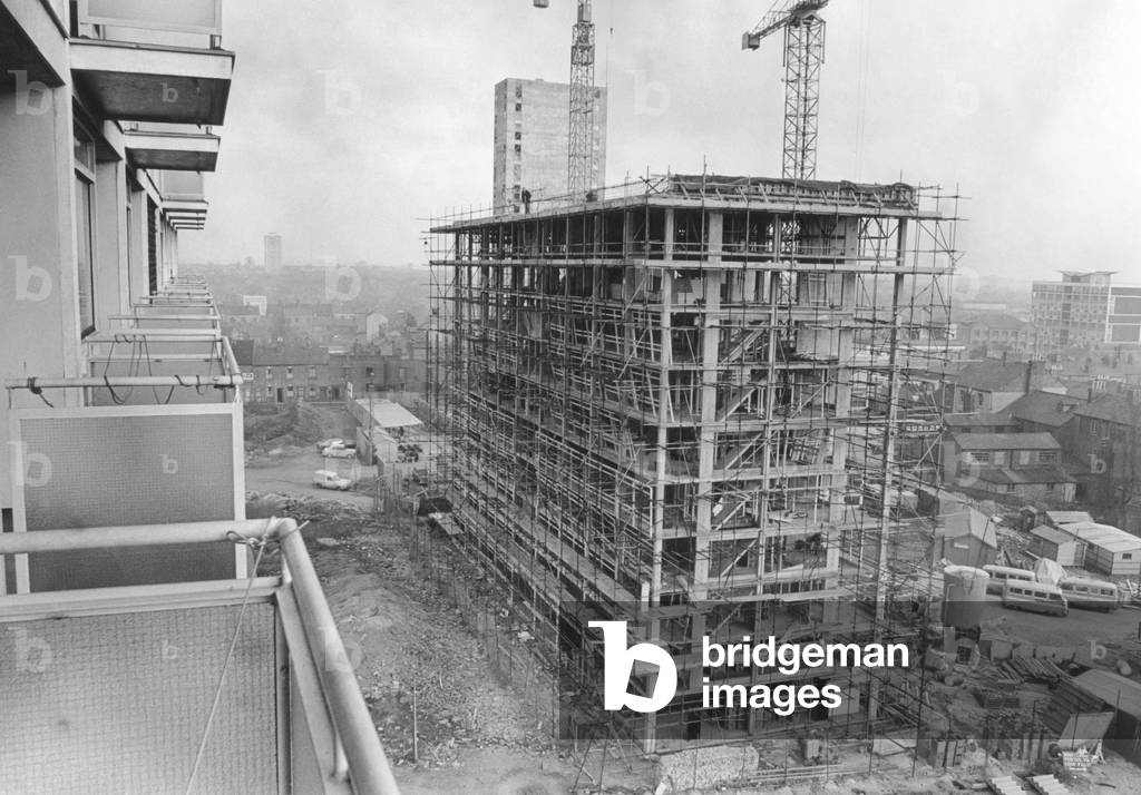 A resident's view from the balcony of a flat in Queen's Street, Coventry, overlooking new flats being built in Hillfields.
12th January 1966