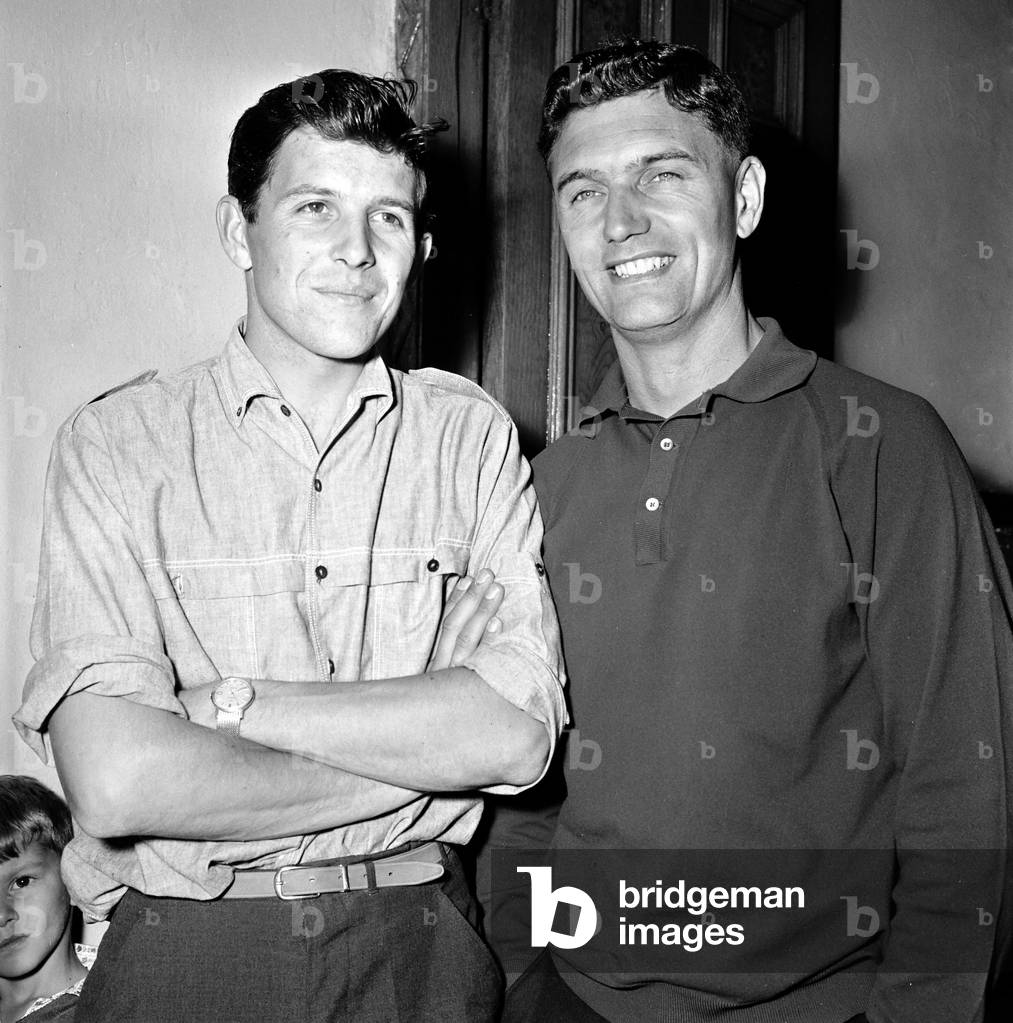 TT Riders Jim Redman (light shirt) and Phil Read. 29th June 1965 (b/w photo)