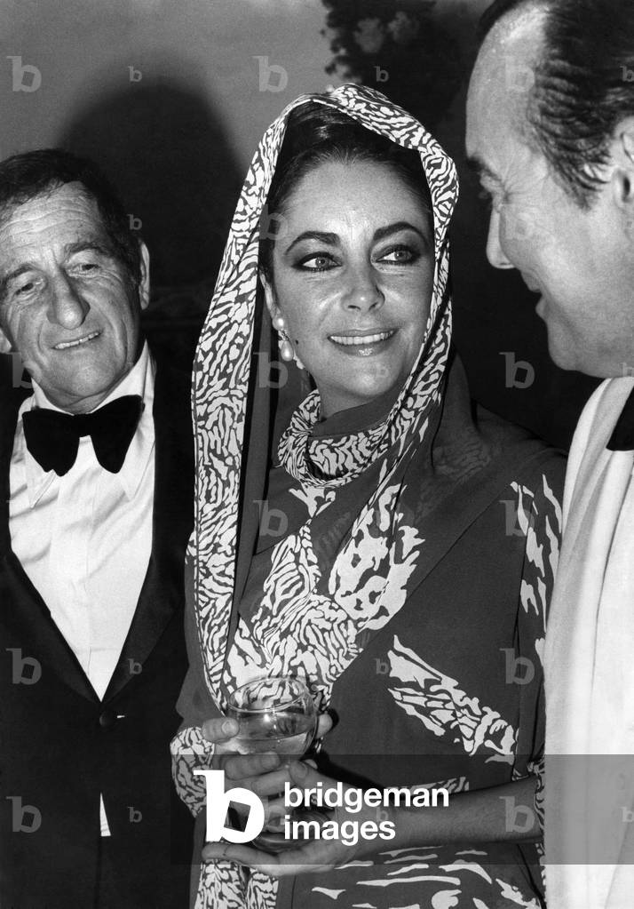 Elizabeth Taylor flew into San Sabastian in her private jet to open the film festival this weekend. Liz Taylor wearing evening dress at the festival. September 1973