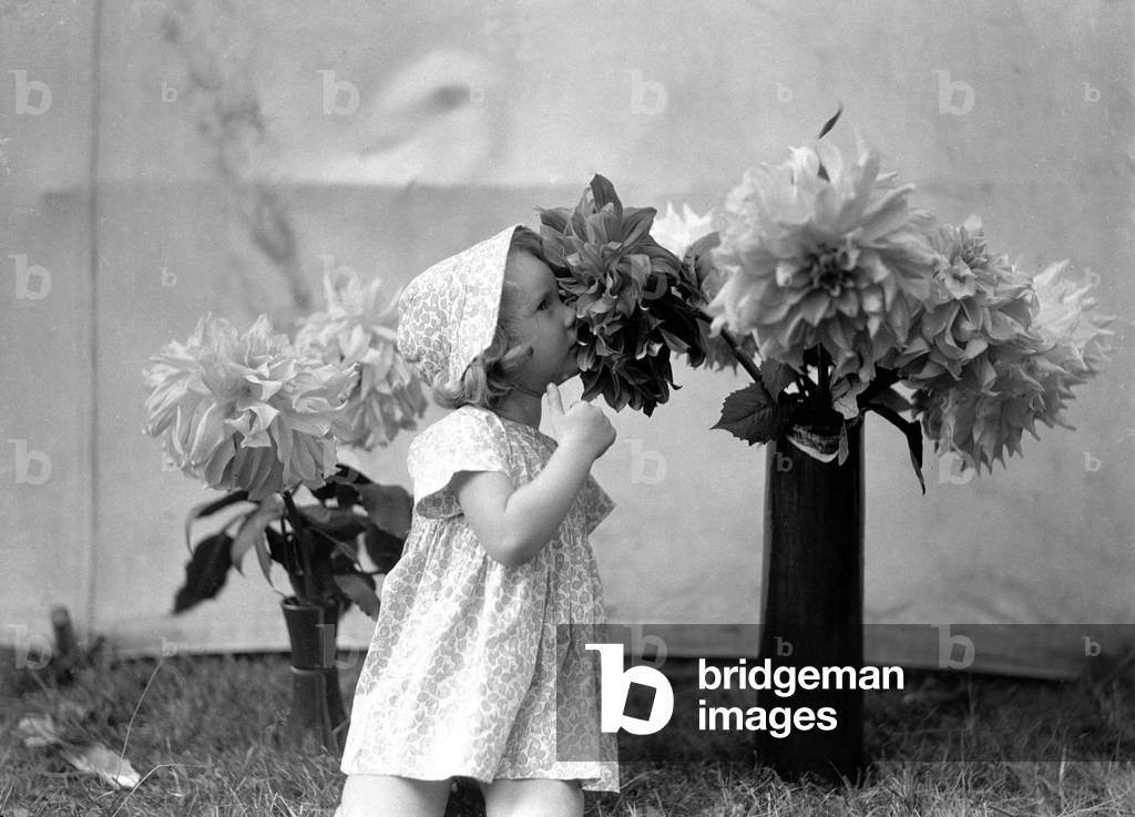 Girl and flowers. 1st June 1935