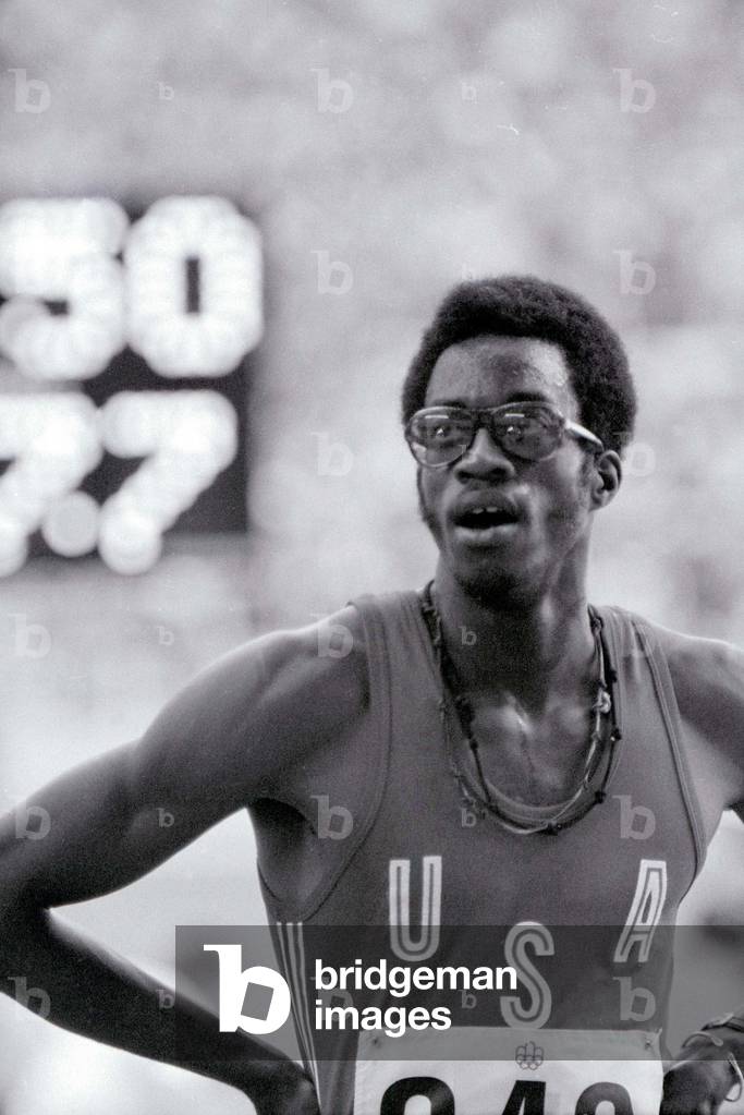 Montreal 1976 Edwin Moses after winning the 400m hurdles final. Not only did Moses win the gold medal in his first international meet, he set a world record of 47.64 seconds, breaking John Akii-Bua's mark of 47.82. His eight-meter victory over Mike Shine was the largest winning margin in the event in the Olympics, Montreal 1976 (b/w photo)