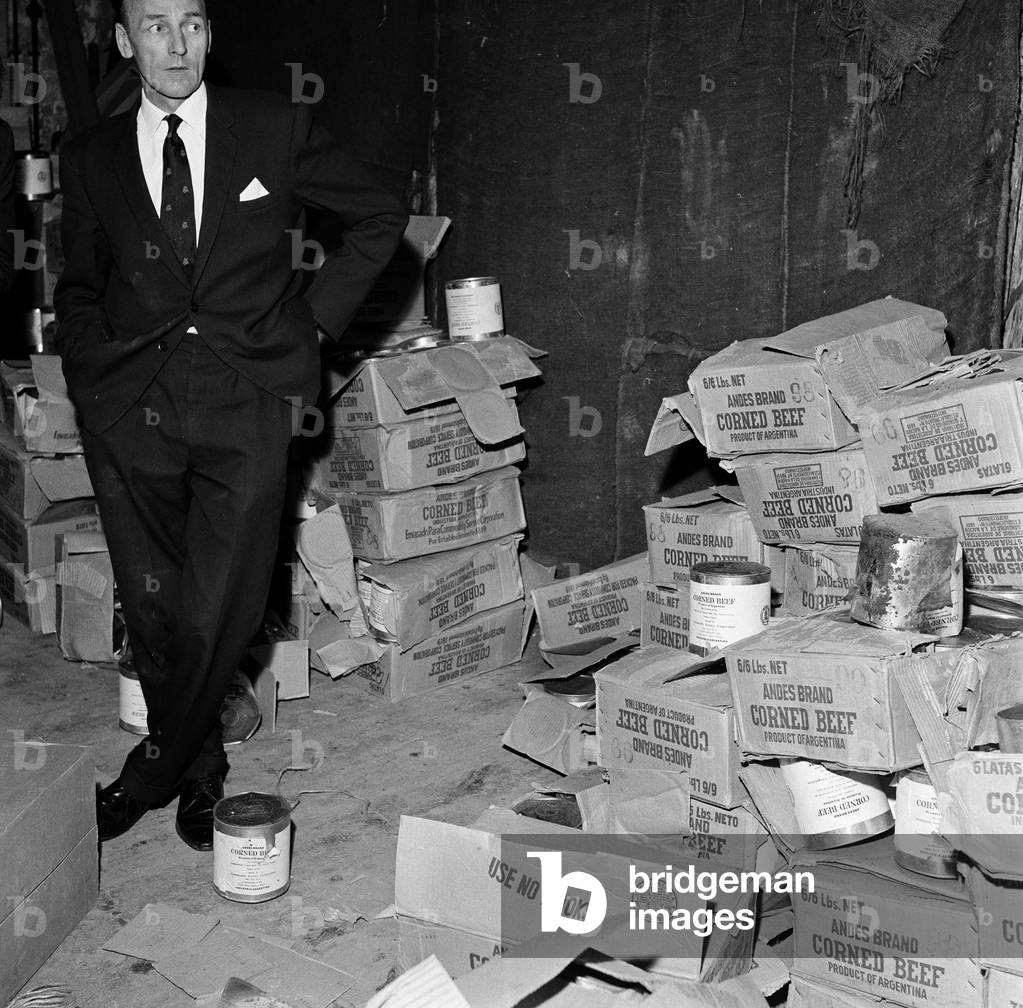 Typhoid outbreak. Aberdeen. Scotland. 1964. In 1964 there was an outbreak of typhoid in the city of Aberdeen, Scotland. The first two cases were identified on 20 May 1964; eventually over 400 cases were diagnosed and the patients were quarantined at the City Hospital in Urquhart Road, but no fatalities resulted. The outbreak was eventually traced to contaminated tinned corned beef from South America made by Fray Bentos and sold in the city's branch of the Scottish grocery chain William Low. The infected meat then contaminated a meat slicing machine within the William Low shop, leading to the spread of the disease. Pictured. Discarded Tins of corned beef from Argentina, 31st May 1964 (b/w photo)