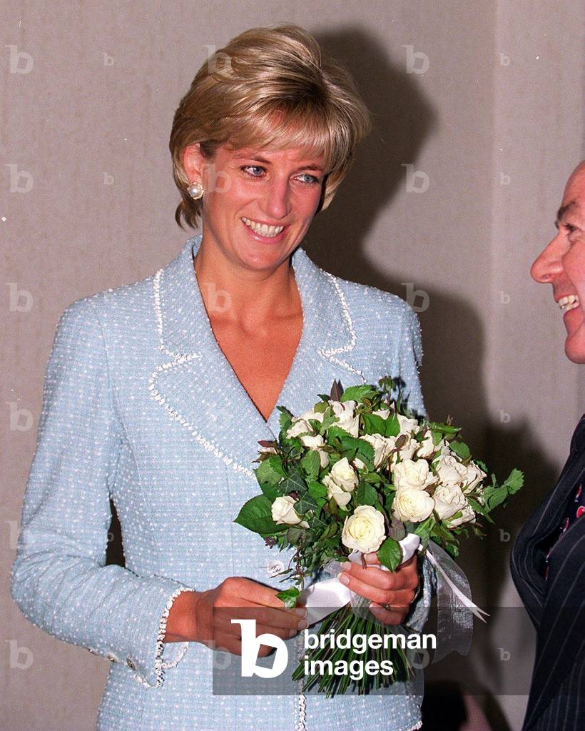 Princess Diana receives a bouquet of roses Princess Of Wales Rose named after her from the British Lung Foundation, April 1997 (photo)