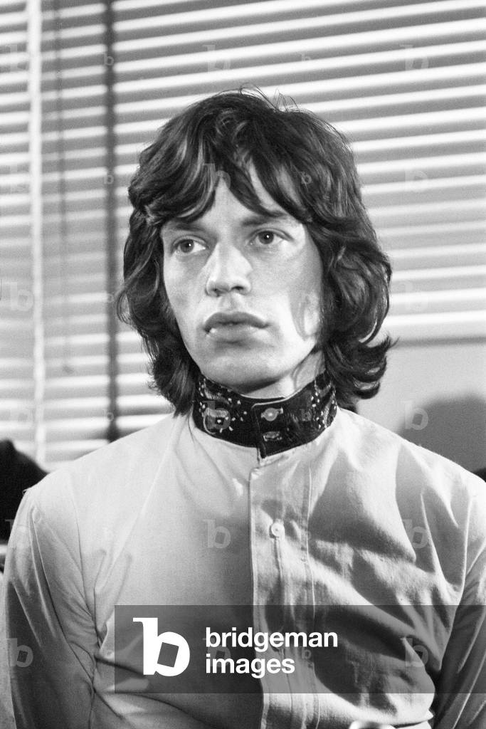 Appeal hearing at the Appeal Court in Central London where Rolling Stones lead singer Mick Jagger and Keith Richards had their convictions and sentence for drug charges set aside by Lord Parker the Lord Chief Justice, Lord Justice Winn and Mr Justice Cusack. Picture shows Mick Jagger holding a press conference in Soho after the hearing where he was given a conditional discharge and talking to in place of his three month prison sentence. 31st July 1967 (b/w photo)