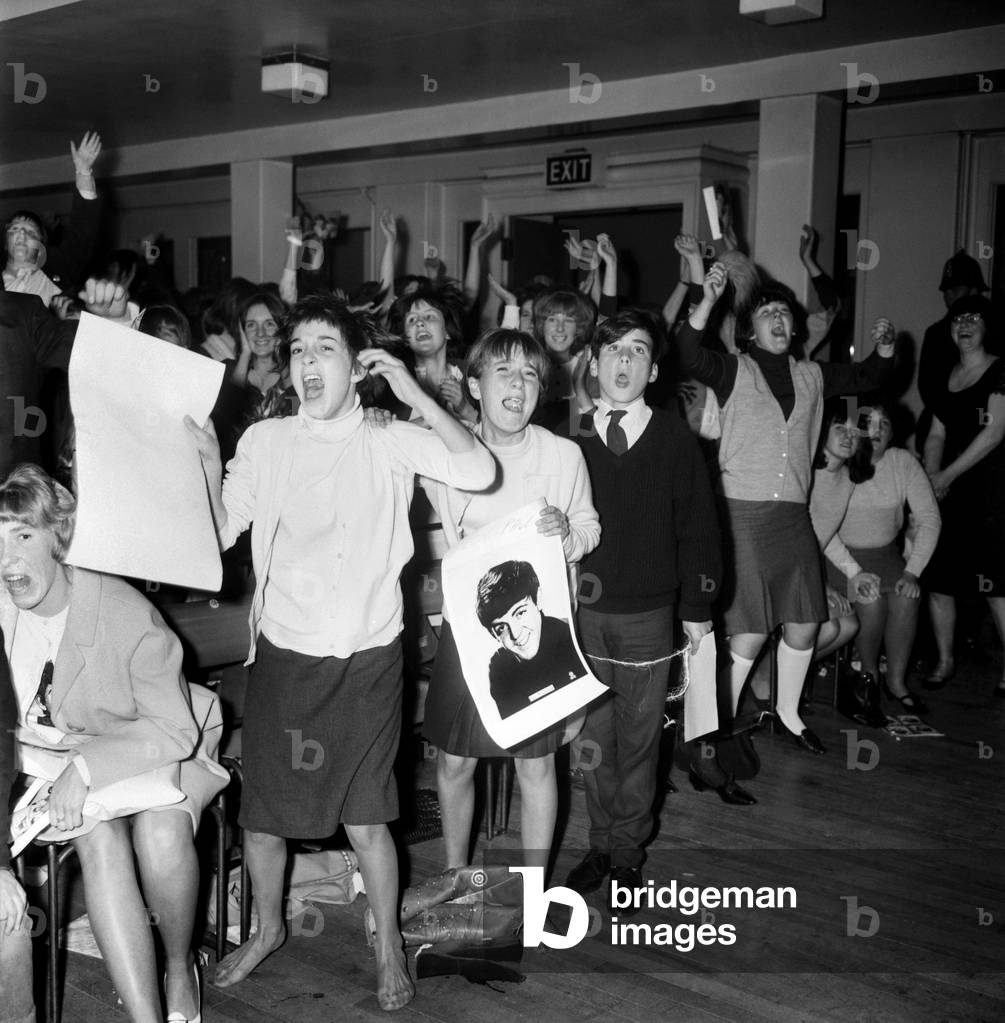 Screaming girl fans greet The Beatles last night on their appearance in Leicester, 11th October 1964 (b/w photo)