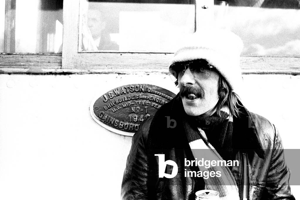 Lindisfarne sailed down the Tyne on a musical journey. The group were filming on board a Tyne ferry for a half-hour television show called 'All Right Now'. 4th March, 1979 (b/w photo)