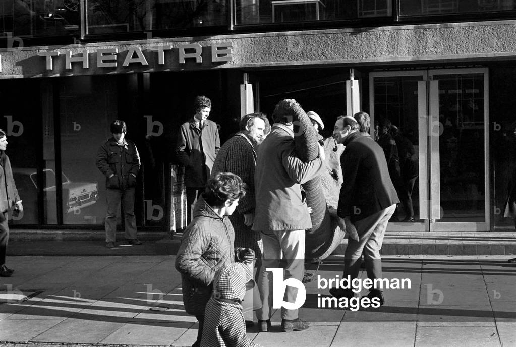 Animals: Humour: Members of the Octagon theatre, Bolton during scenes for a film using an Elephant. December 1969