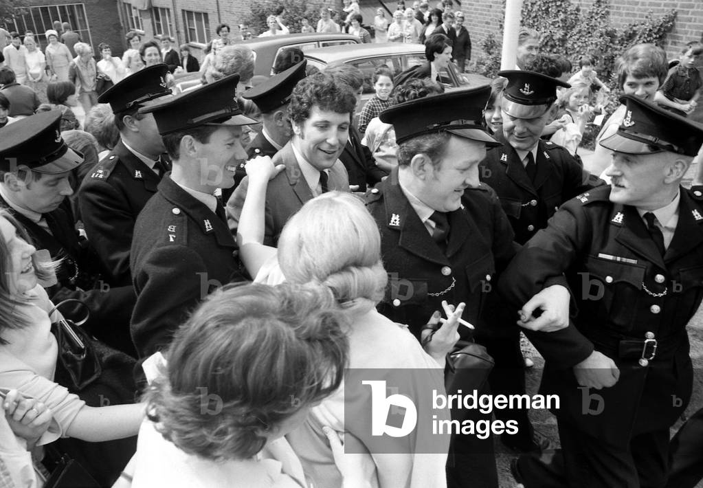 Welsh singerTom Jones visited Corley Residential School's garden fete in Coventry and was presented with a silver tankard. The money raised at the fete will go to building a swimming pool at the school for delicate children. 10th June 1967 (b/w photo)