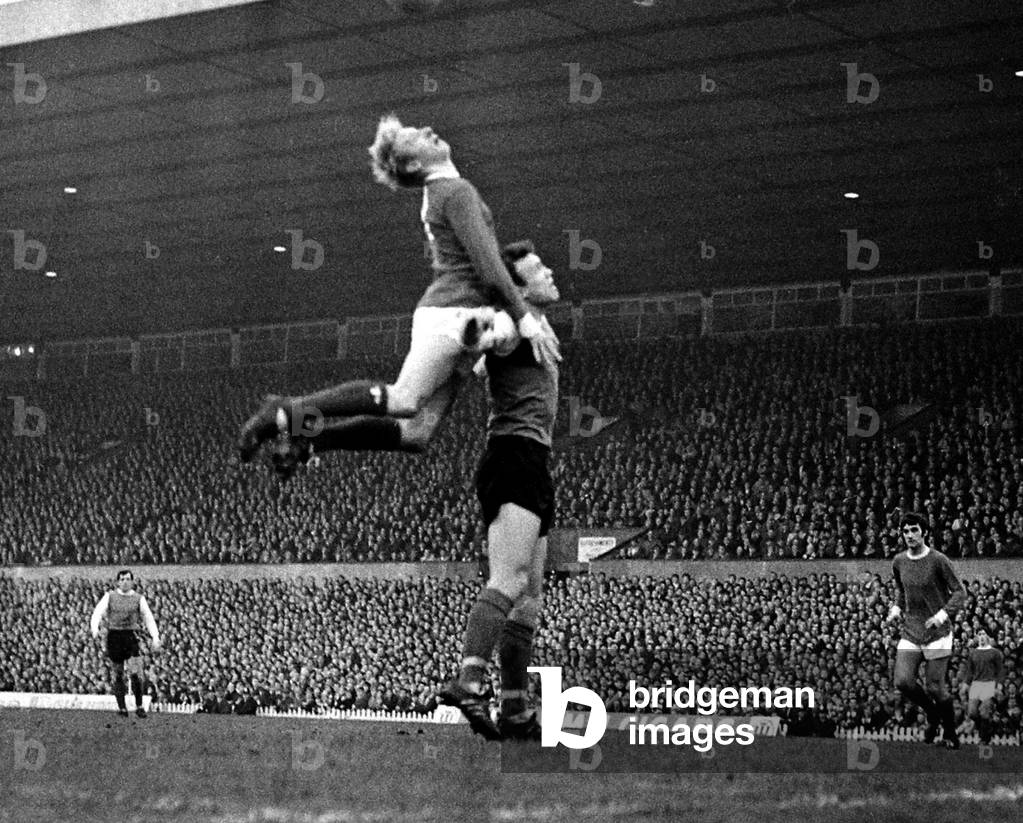 Denis Law of Manchester United jumps up for the ball during the league match against Sheffield Wednesday at Old TraffordJanuary 1968 (photo)