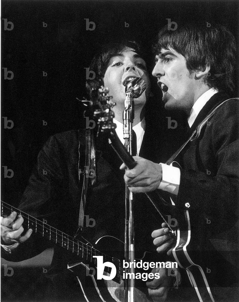 Paul McCartney and George Harrison in concert on the second night of their US tour at the convention centre Las Vegas Nevada 20th August 1964 (b/w photo)