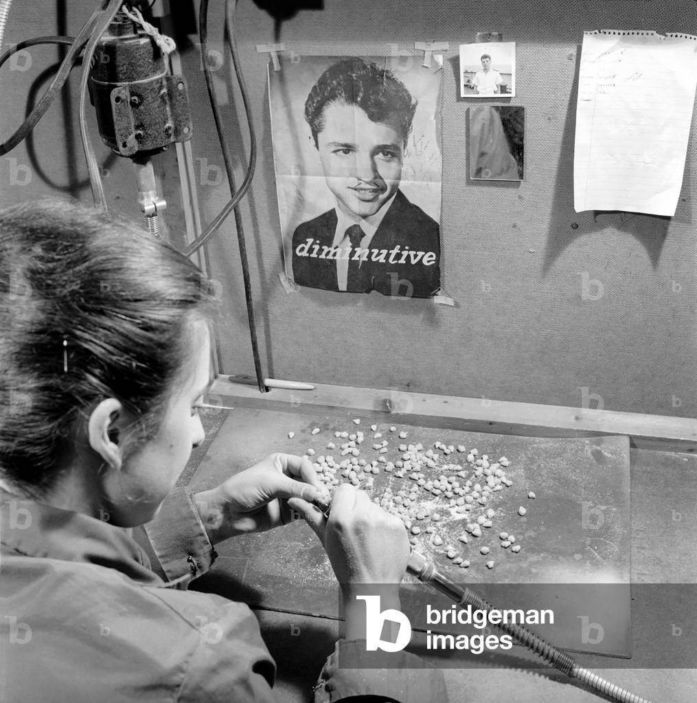 False teeth factory in Dundee: The factory makes and bakes in their kiln (oven) false teeth for all U.K. N.H.S. dentists, 1963 (b/w photo)