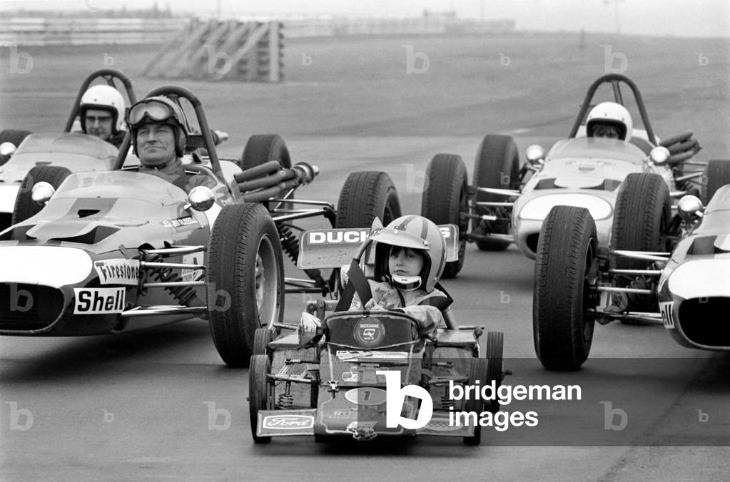 Angela four year old daughter of Ken James seen here at the wheel of her miniature petrol driven racing car February 1975