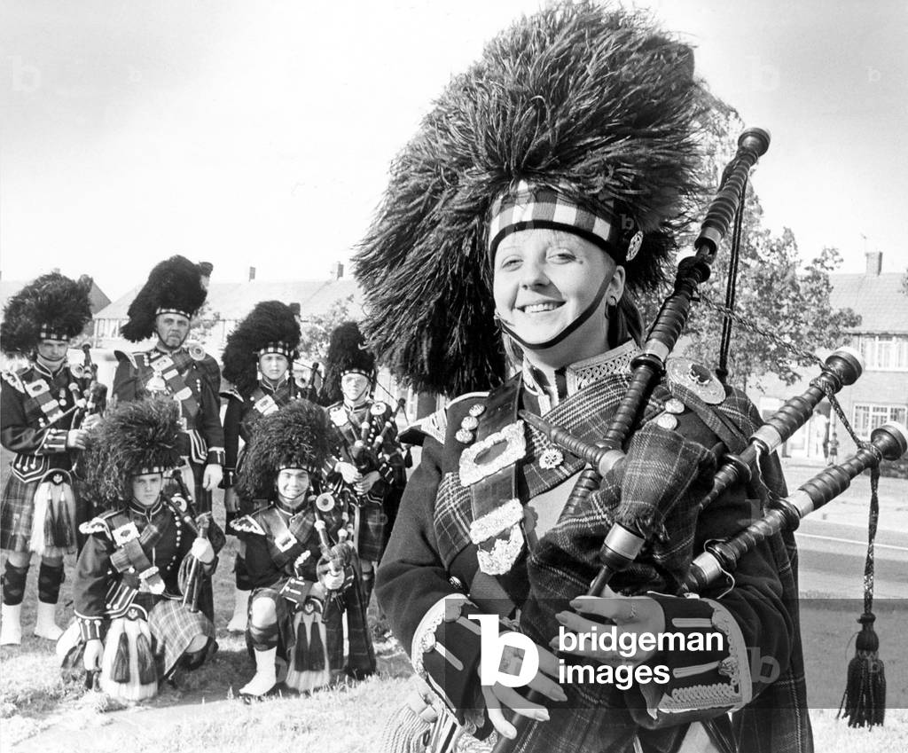 Debbie White, 20, the only girl member of the South Tyneside Pipe Band in June 1986, who are playing at the Commonwealth Games in Edinburgh. 29/06/1986 (b/w photo)