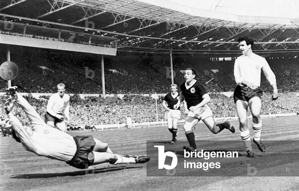 England v Scotland home international at Wembley Stadium April 1963. Scotland player Jim Baxters (not in picture) scores a goal England Goalkeeper Gordon Banks diving for ballAlso PicturedIan St John Denis Law (photo)