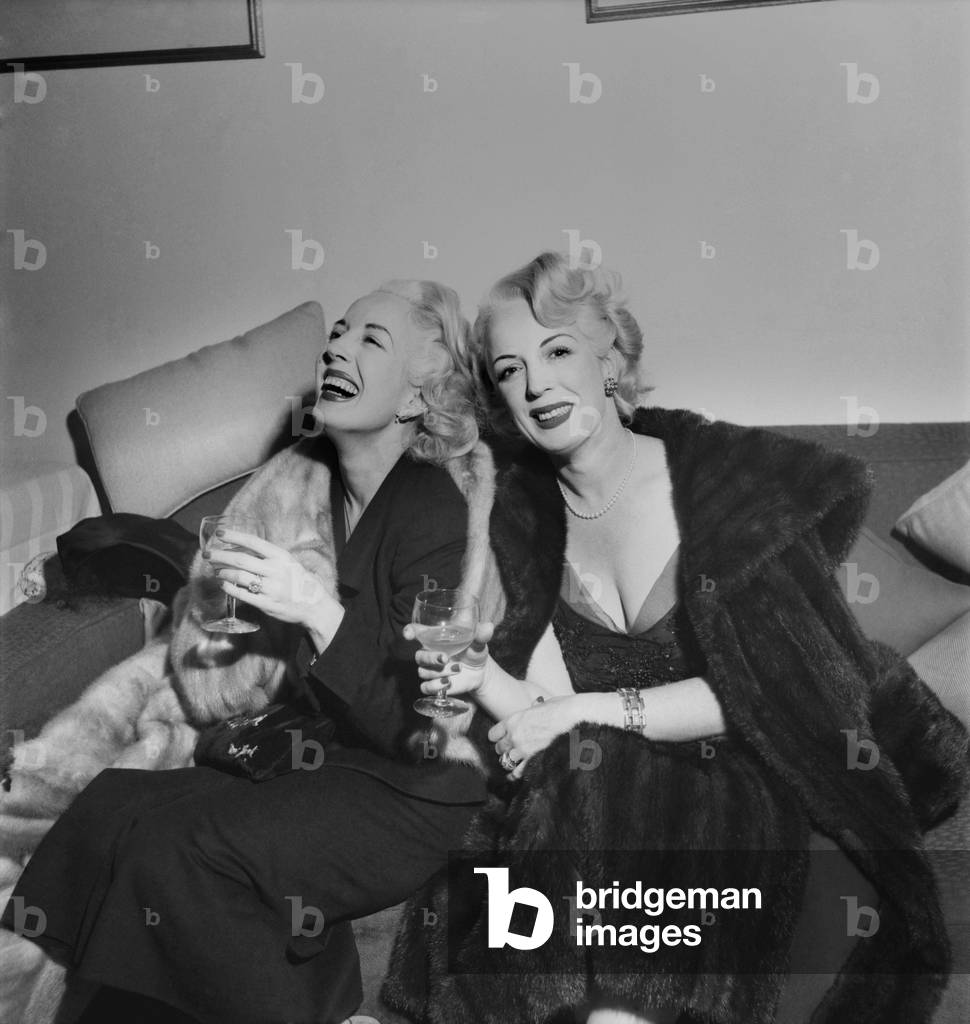 Mrs. Tommy Manville (9th) & her Twin sister - Seen here celebrating. December 1952 C6105
