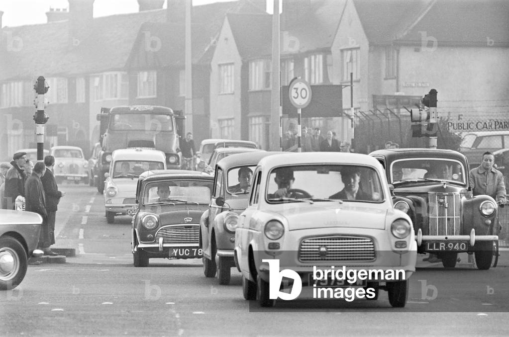 Traffic in High Street Dagenham as the Ford factory turns out at the end of the day shift. 2nd October 1963 (b/w photo)