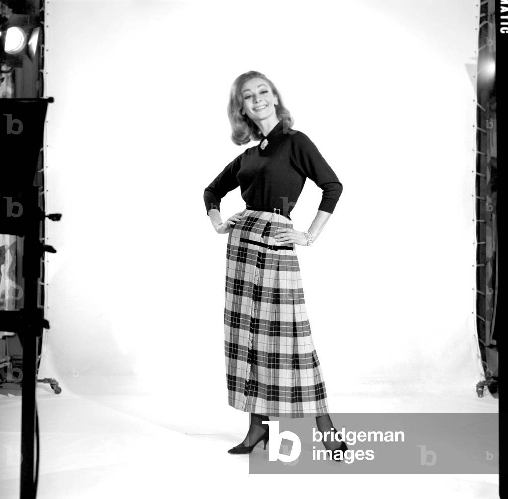Danny Rendell modelling tartan skirt, 1963 (b/w photo)