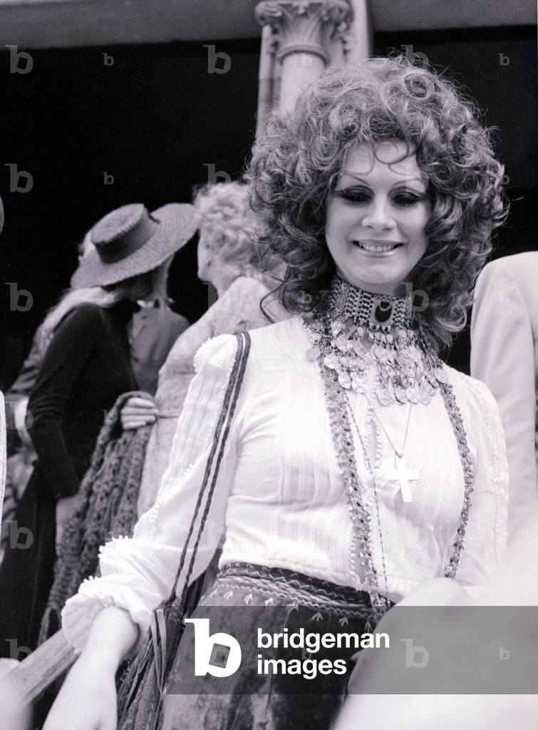 Transgender model April Ashley pictured during the wedding of Arabella Churchill and James Barton at the Essex Unitarian Church in Kensington, August 1972 (b/w photo)