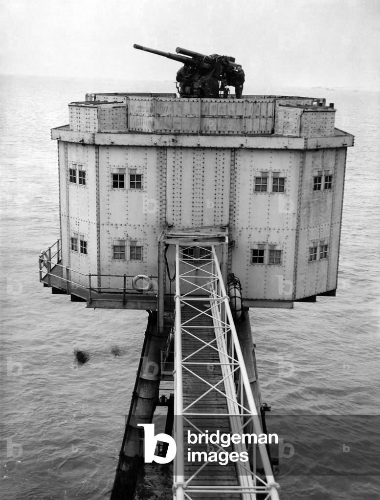 An Ack Ack gun mounted on top of one of the forts ready to give a warm welcome to any maurauder note the tubular bridge connecting the forts each with its neighbour. November 1944