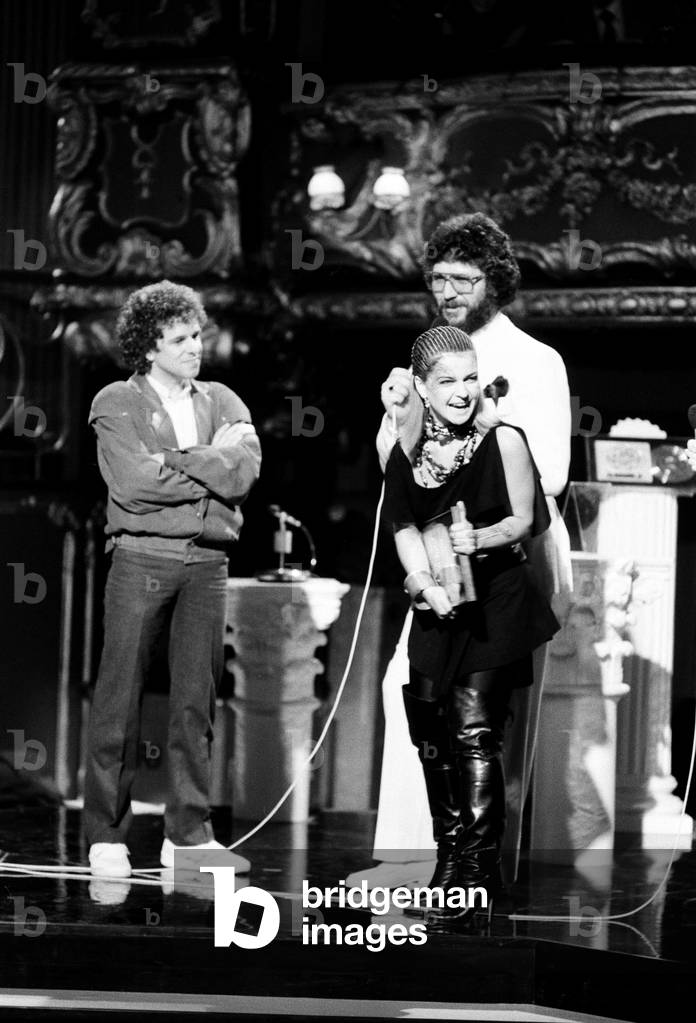 Daily Mirror British Rock & Pop Awards at The Lyceum, London. Toyah Willcox receiving 'Best Female Singer of 1981' award. Pictured on stage with Leo Sayer and Dave Lee Travis. 23rd February 1982.