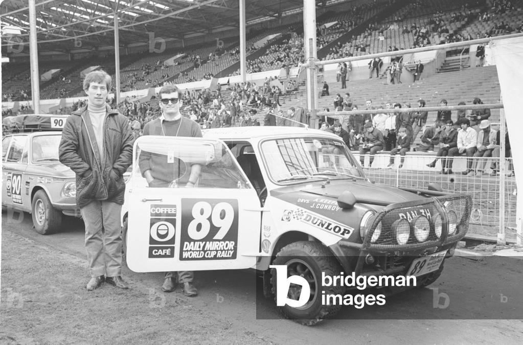 Allan Keefe and J Conroy beside their Austin Mini Cooper S at the start of the Daily Mirror World Cup Rally April 19th 1970
