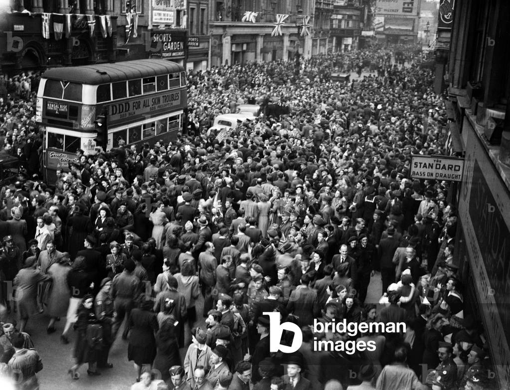 VE Day celebrations in London at the end of the Second World War. Huge crowds gathered around Piccadilly Circus during the celebrations., 8th May 1945 (b/w photo)