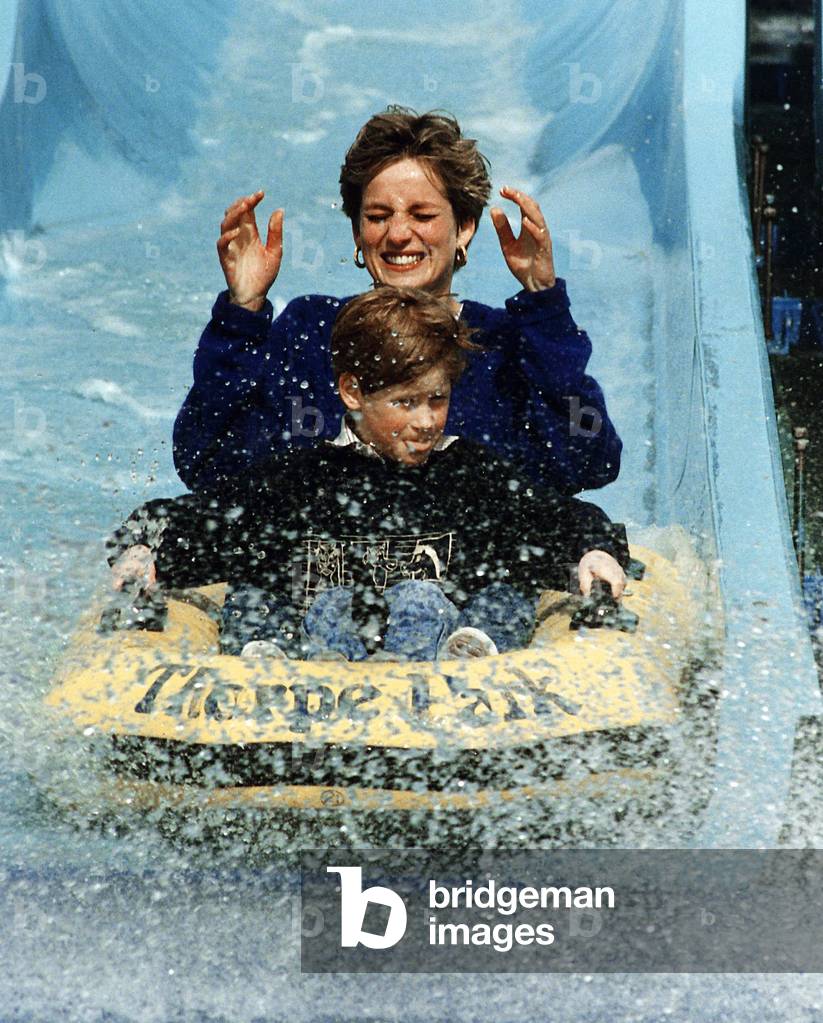 Princess Diana and Prince Harry laughing and getting soaked on water slide ride in Thorpe, 1992 (photo)