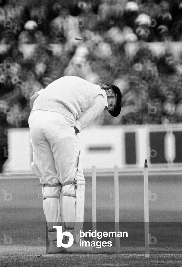 England v Australia Ashes 3rd Test match at Trent Bridge in Nottingham, July & August 1977. England won by 7 wickets. Picture shows: England batsman Tony Greig is bowled by Aussie Jeff Thomson for 11 in the 1st innings, July 1977 (b/w photo)